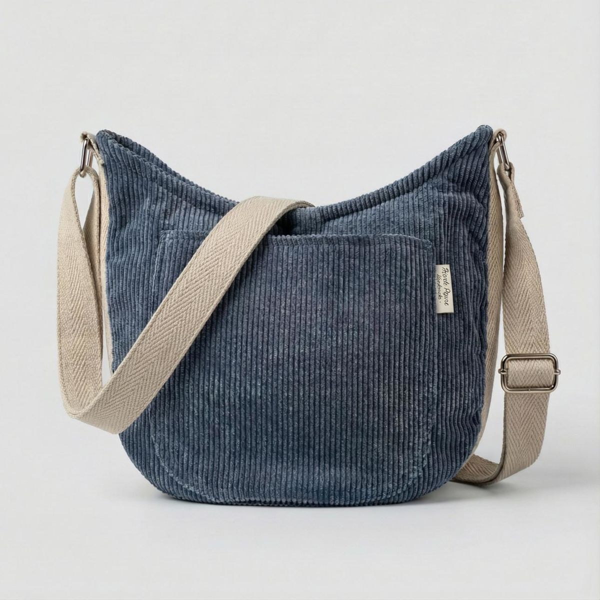 Bolso bandolera de pana con bolsillo exterior Bolso bandolera de pana azul con bolsillo exterior frontal y correa ajustable, vista frontal